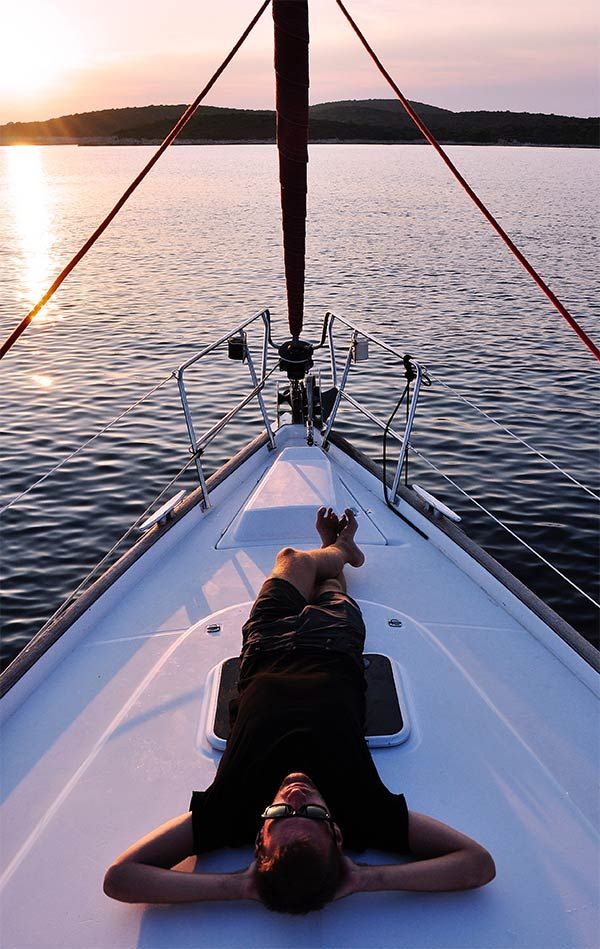 Young man rest atop a boat